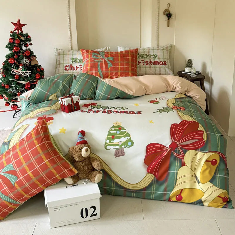Christmas cartoon print bedding four-piece set on a bed, showing duvet cover and pillowcases.