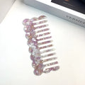 Acetate board geometric wave hairdressing comb for women in pink colour, showing wave shape and lightweight construction