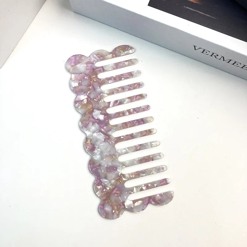 Acetate board geometric wave hairdressing comb for women in pink colour, showing wave shape and lightweight construction