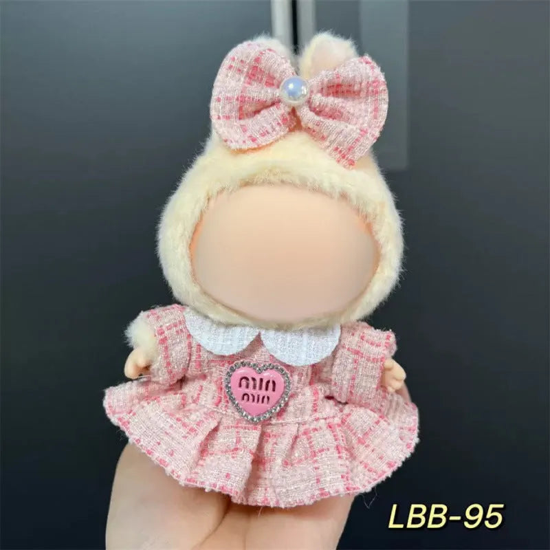 Plastic doll costume outfit designed for 17cm tall vinyl figurines on a display stand.