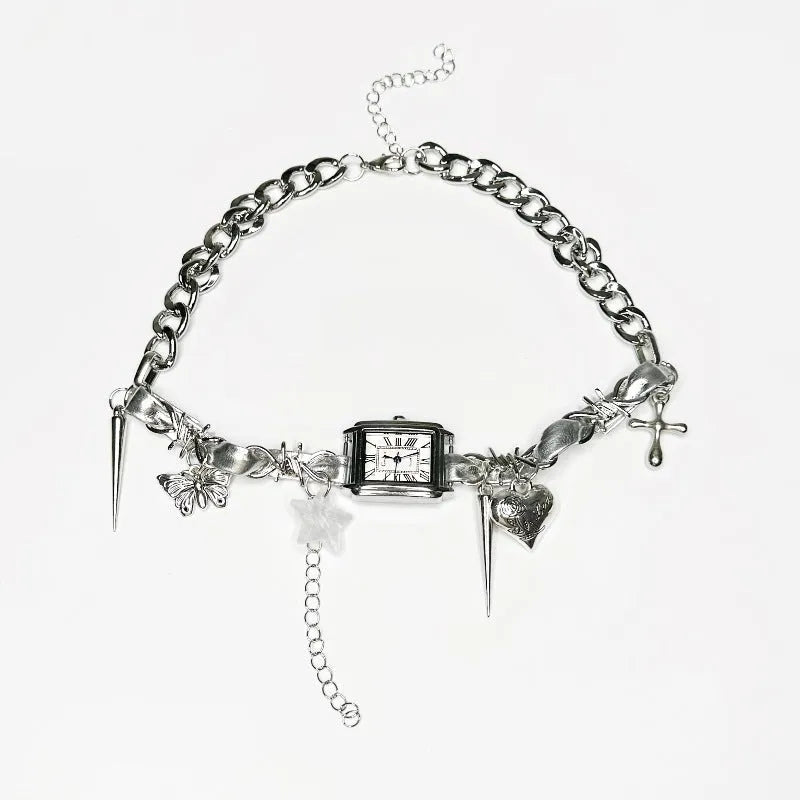 Dark multi-layer cross necklace with twin clavicle chain and textured hemp flowers chain on model