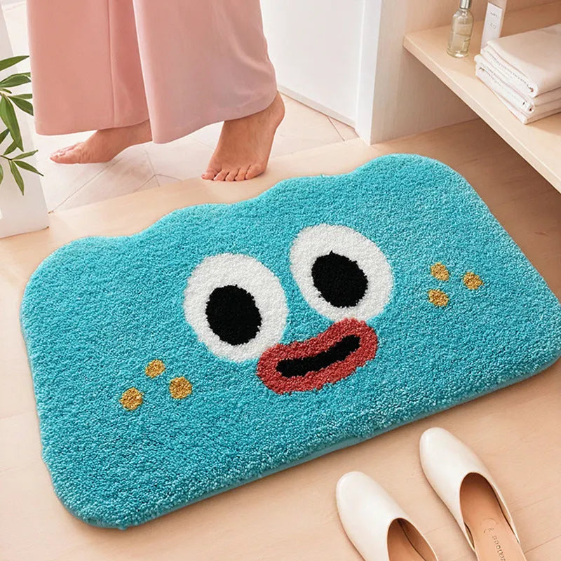 Cartoon anime character printed bathroom mat in green, blue, pink, black, or white, available in three sizes.