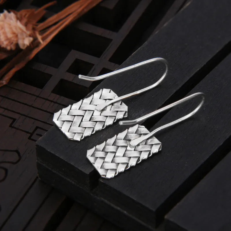 Geometric diamond plaid pattern earrings made from silver-coloured 925 silver.