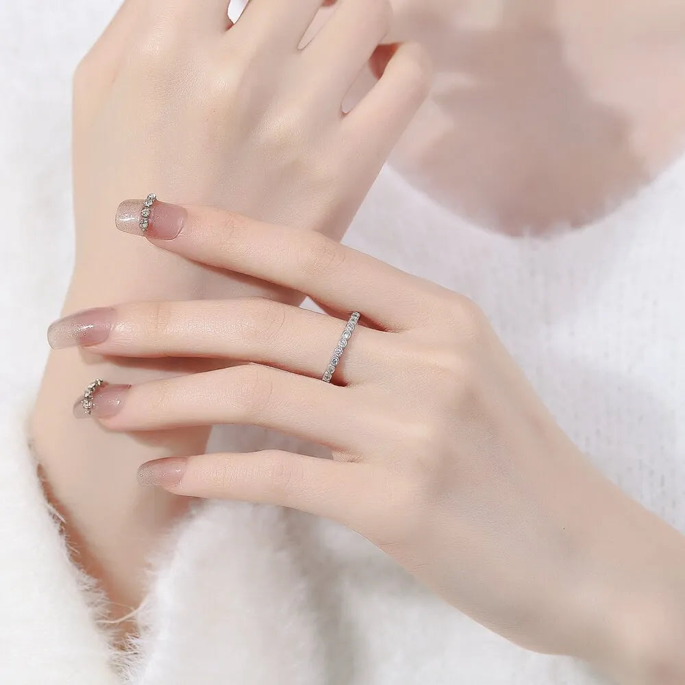 Women's geometric diamond tail ring in electroplated copper, shown in white gold colour and yellow gold colour finishes.