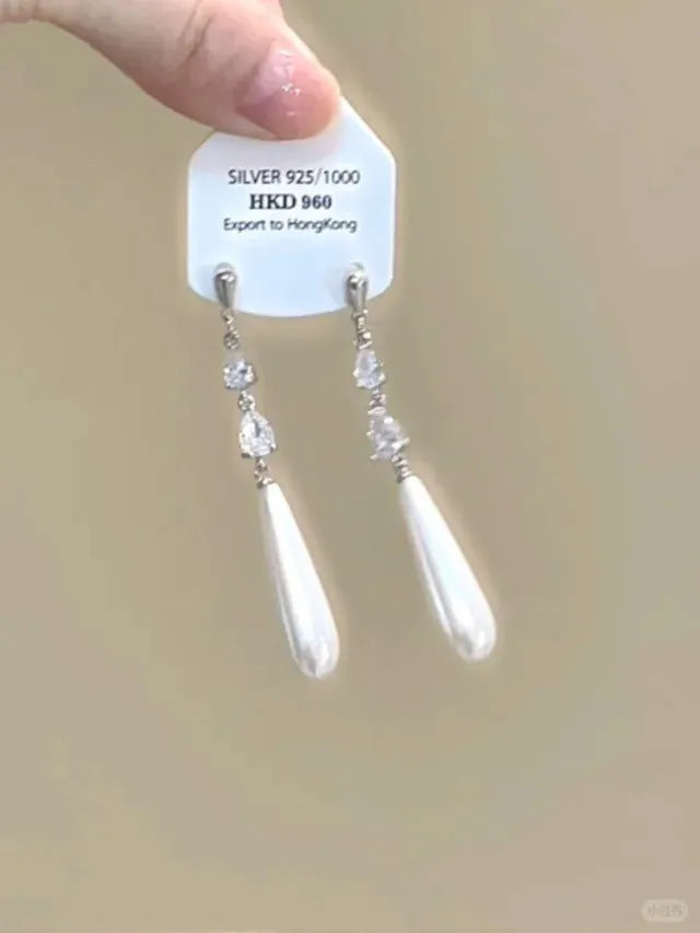 Alloy heart-shaped geometric ear clip with rhinestone detailing and star tassels