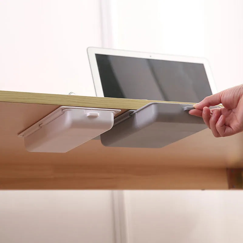 Plastic under-table storage drawer with adhesive mounting in grey colour