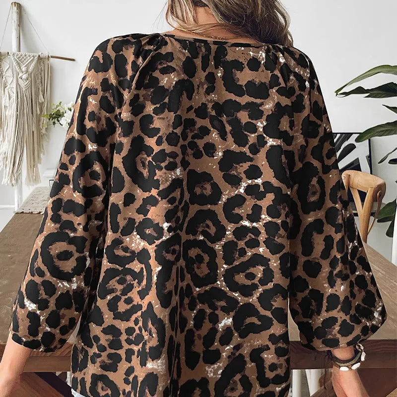 Women's multicolor leopard print half sleeve V-neck pullover top with pleating detail