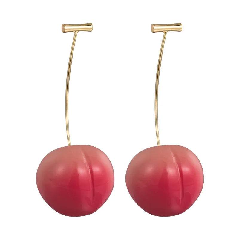 A pair of women's acrylic earrings shaped like juicy peaches on copper findings.