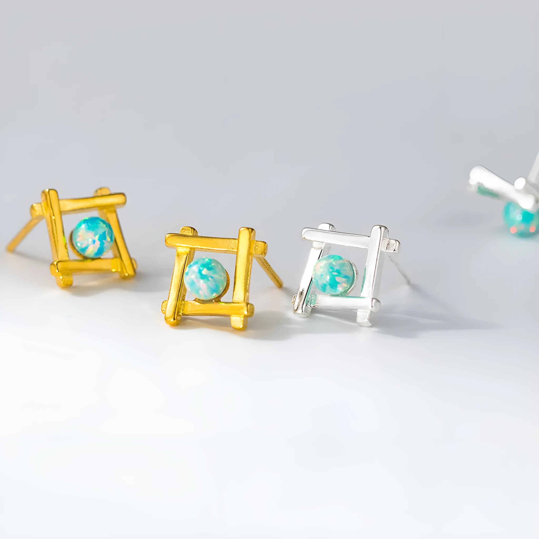 Women's silver geometric cross quadrangle stud earrings with a choice of gold or silver plating.