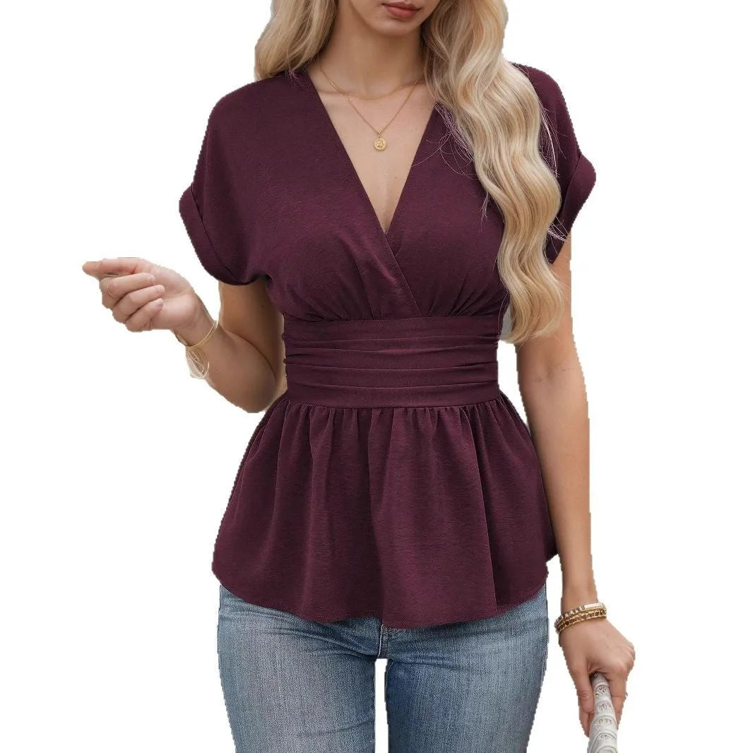 Women's black V-neck short-sleeve top with waist pleats, slim fit, on a hanger.