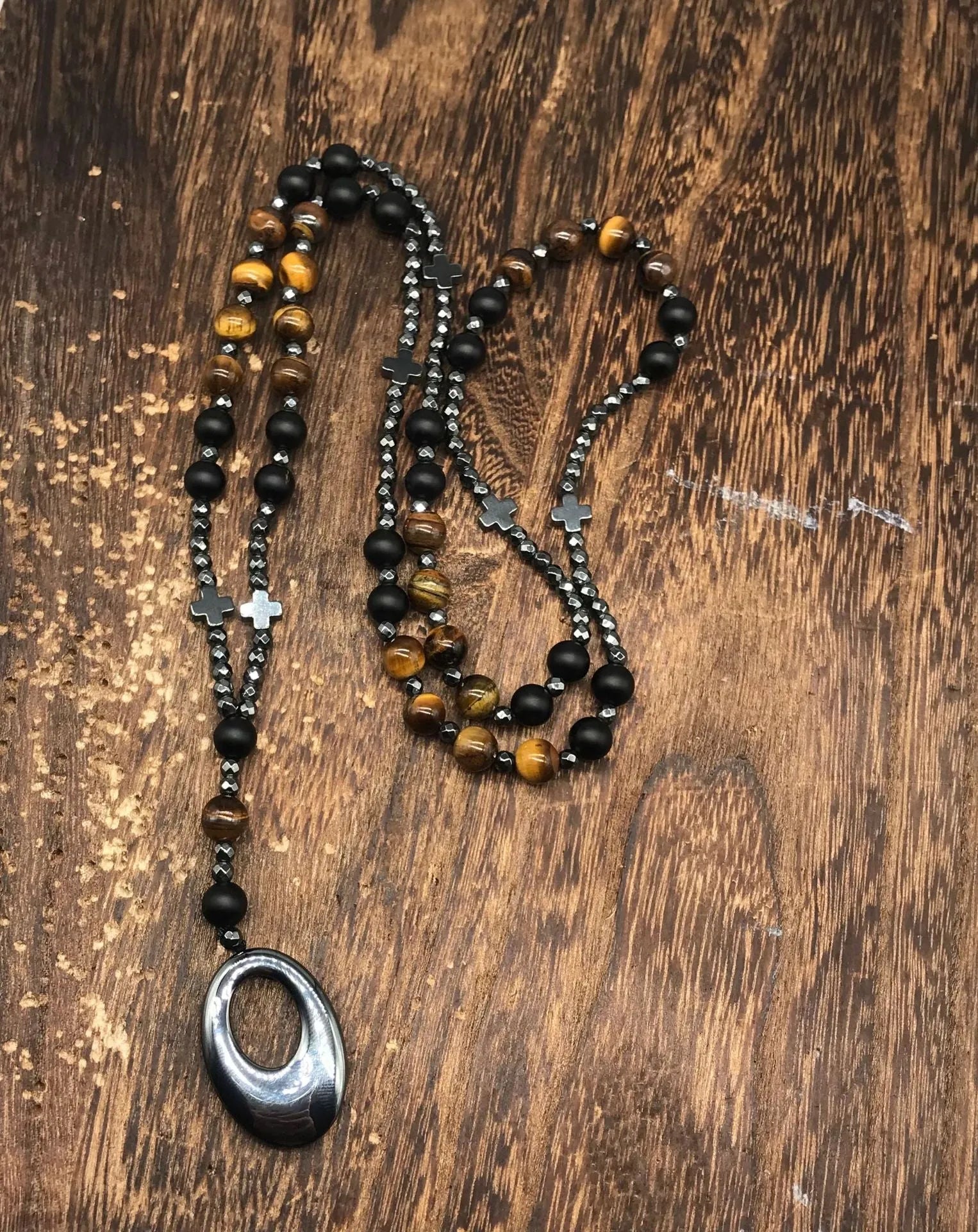 Men's stone cross pendant necklace with hand-woven detail on ball bead chain