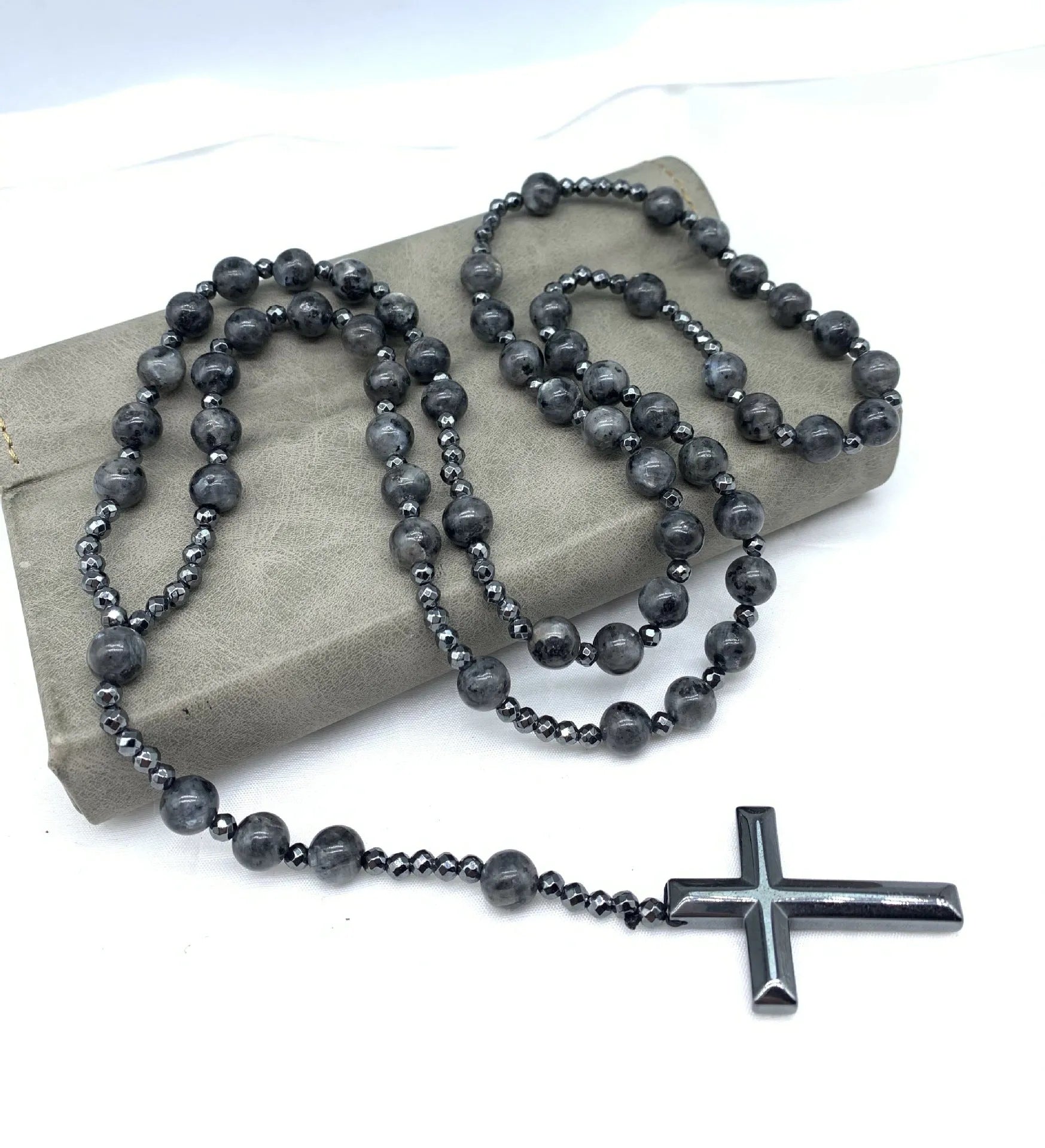 Men's stone cross pendant necklace with hand-woven detail on ball bead chain