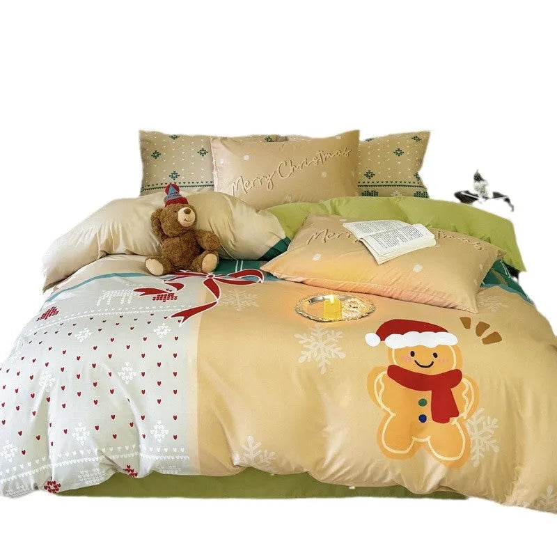 Christmas cartoon print bedding four-piece set on a bed, showing duvet cover and pillowcases.