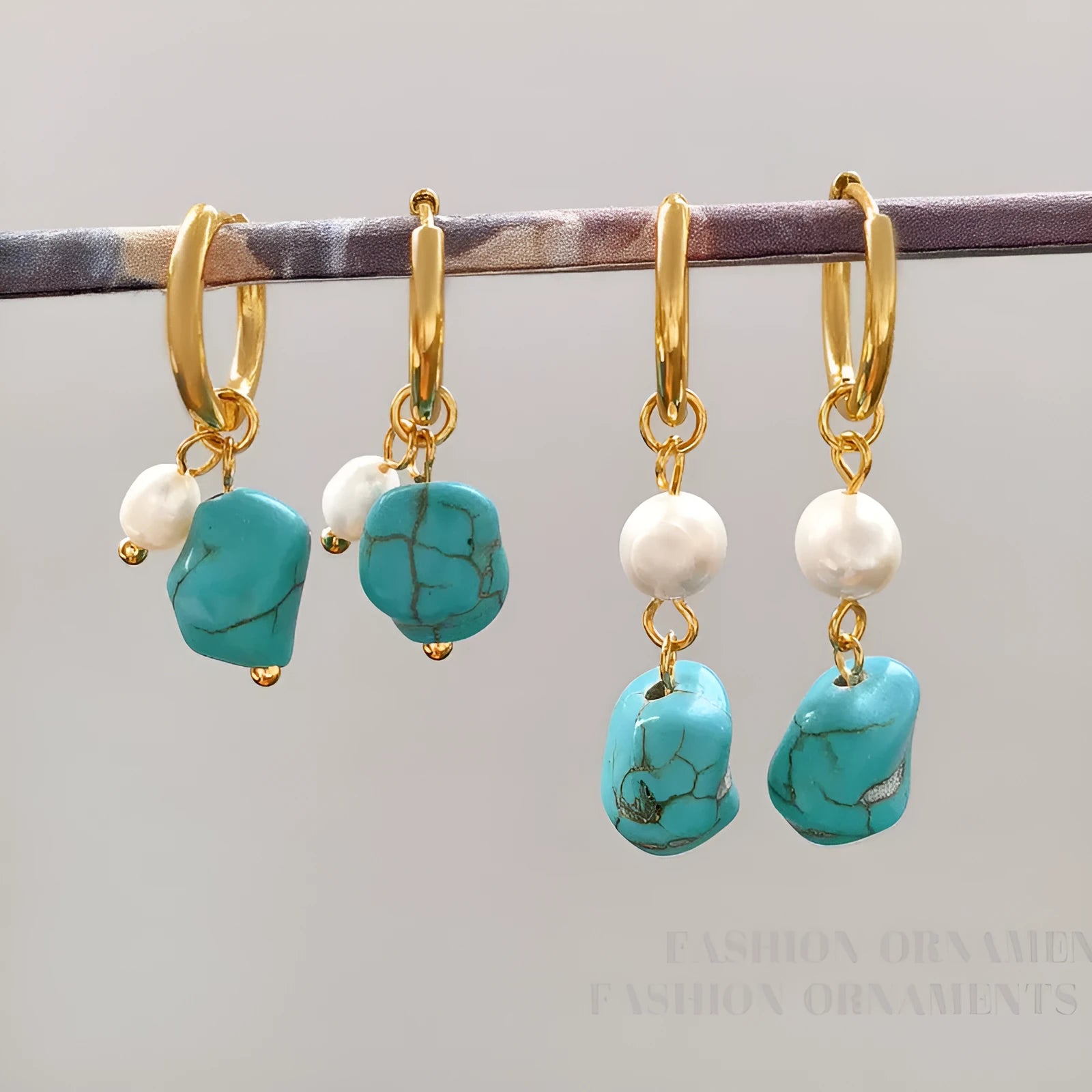 A pair of long and a pair of short geometric clip-on earrings with turquoise and cultured pearls.