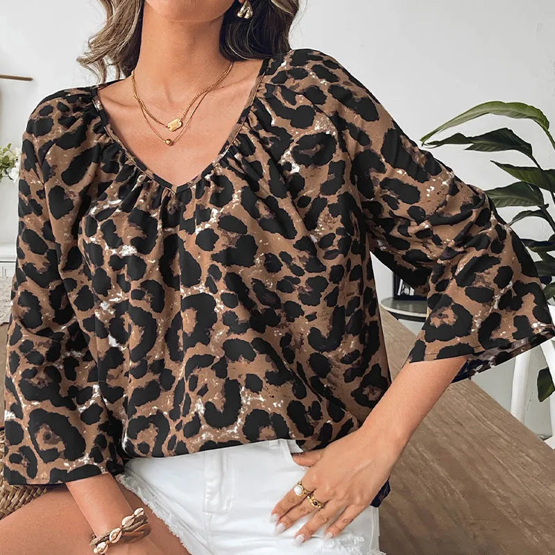 Women's multicolor leopard print half sleeve V-neck pullover top with pleating detail