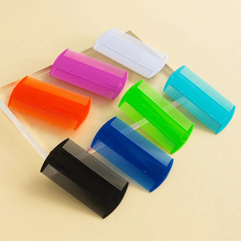 Double-edged plastic fine tooth flea and lice comb in assorted colours on a white background.