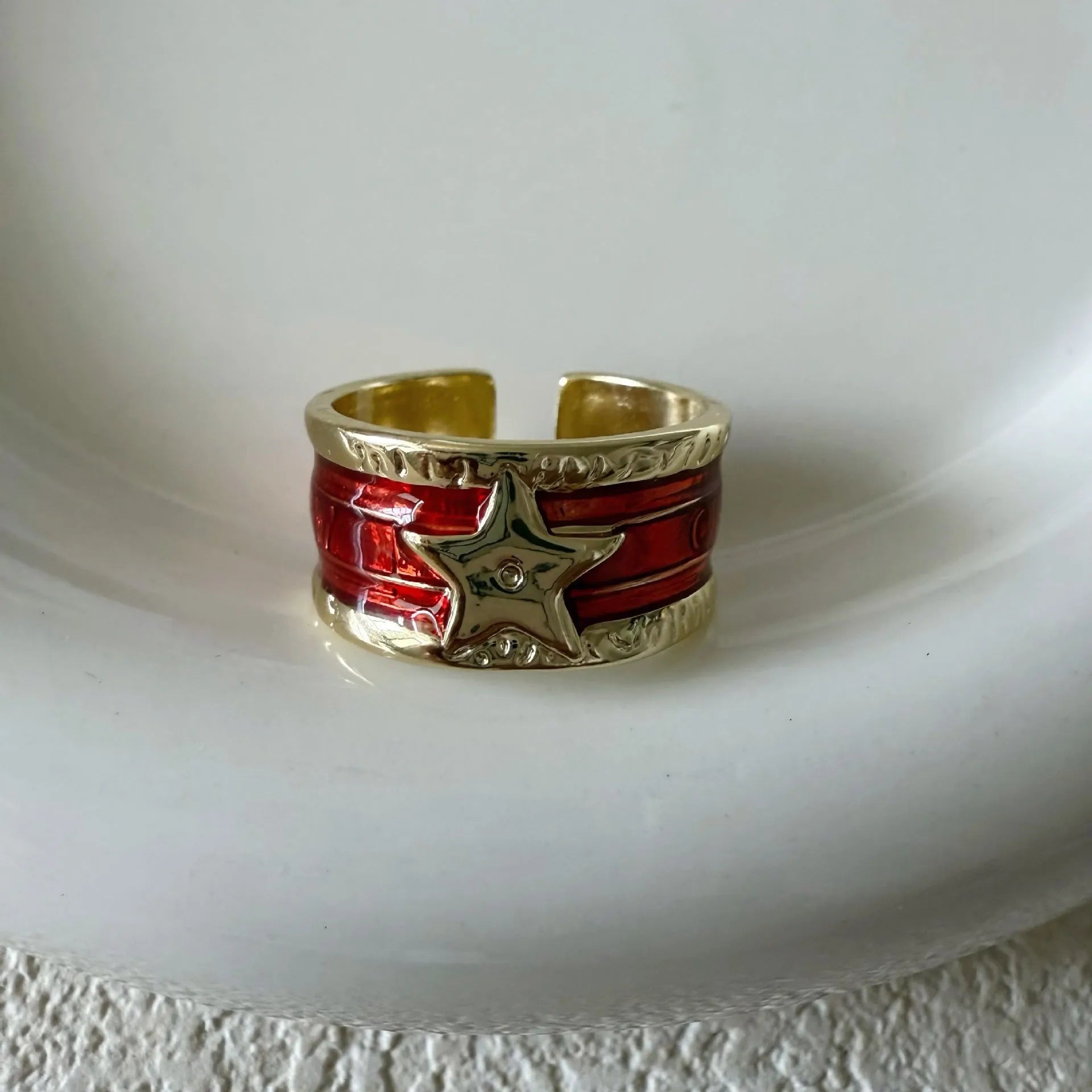 Adjustable geometric copper ring with a distressed electroplated finish in a choice of colours.