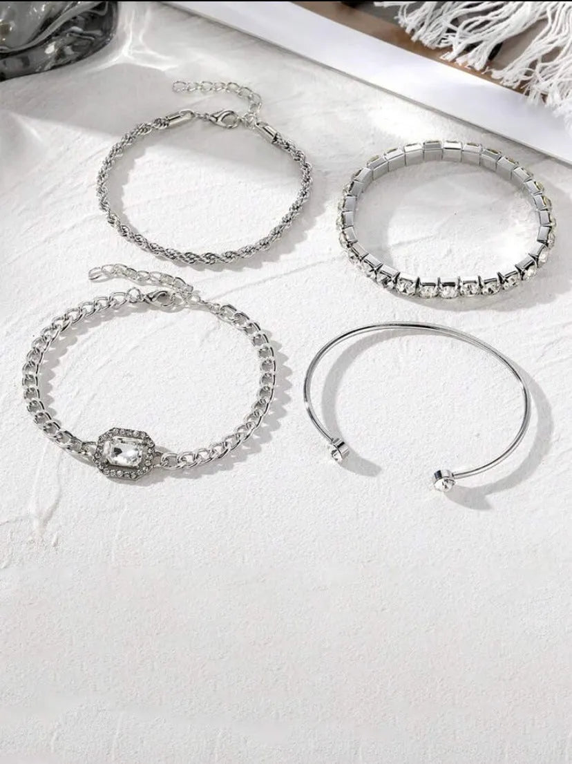 Four geometric retro-style alloy bracelets with square diamond design in gold and silver colours