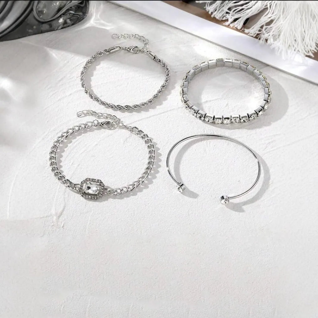 Four geometric retro-style alloy bracelets with square diamond design in gold and silver colours