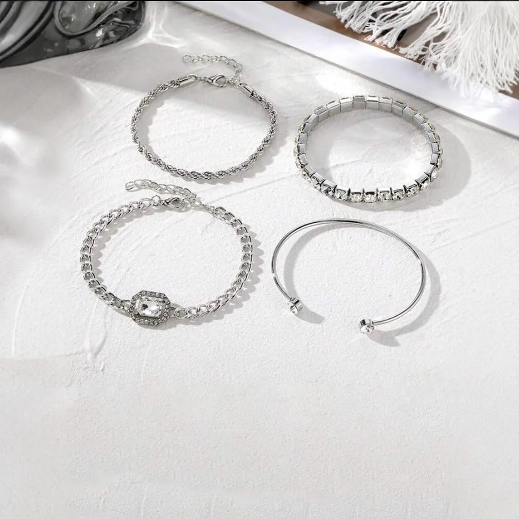 Four geometric retro-style alloy bracelets with square diamond design in gold and silver colours