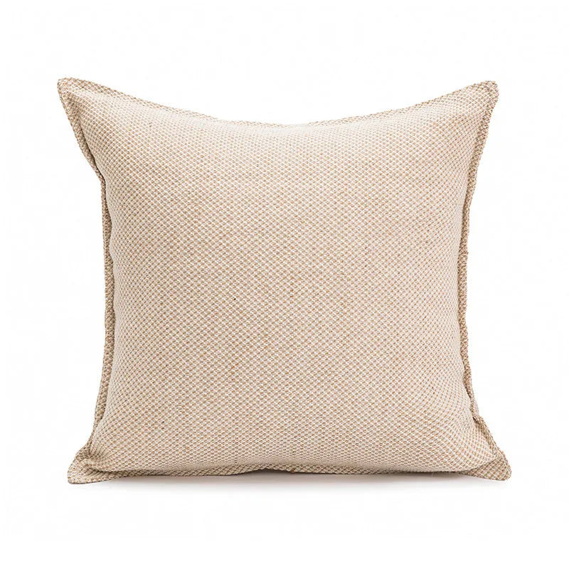 Solid colour rectangular and square sofa cushions with removable covers on a bay window seat