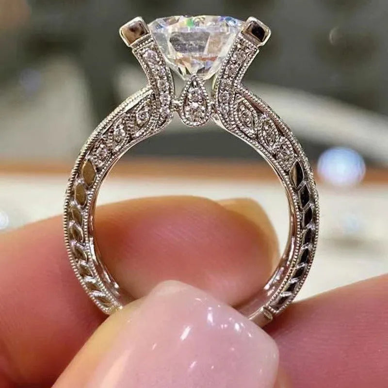 Women's silver geometric engagement ring with electroplated gold or white finish and round design