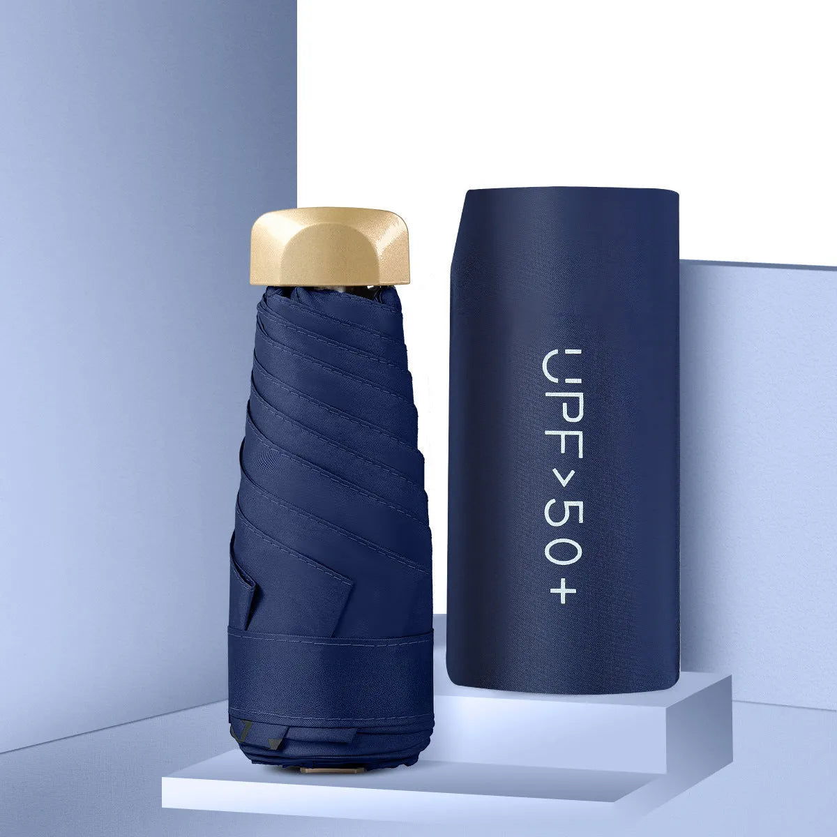 Compact folded five-fold sun umbrella showing NC fabric canopy and rubber handle