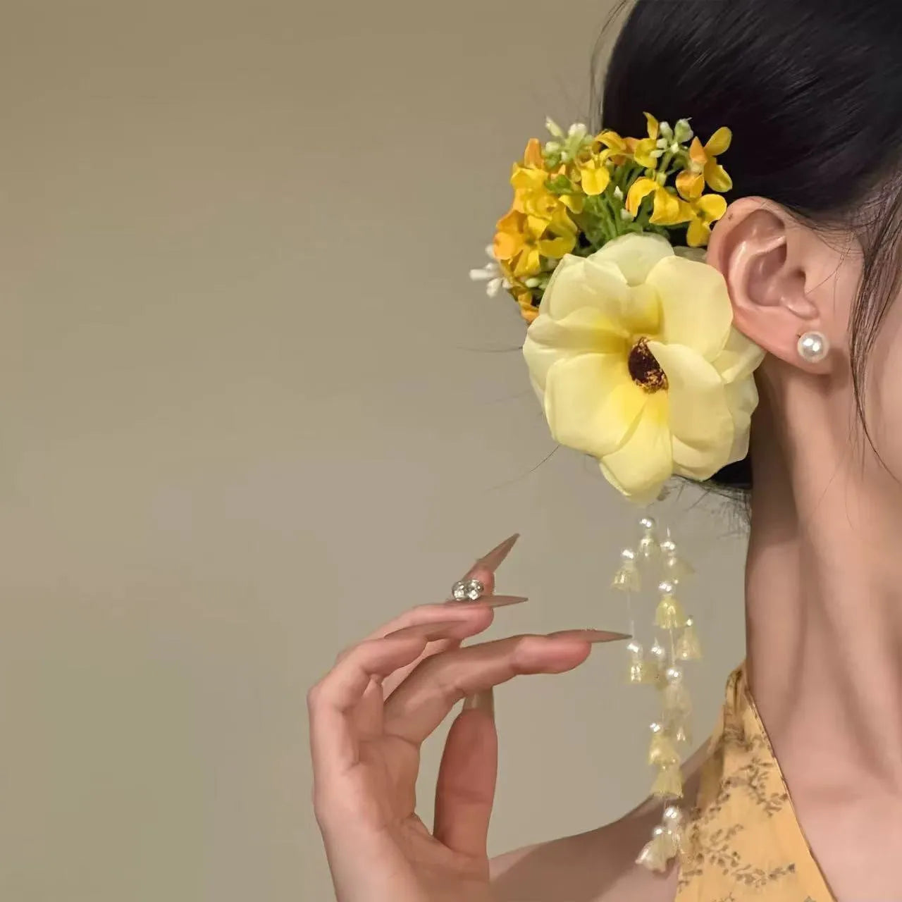 Yellow and purple floral tassel side clip hair accessory for women.