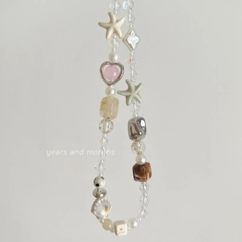 Bohemian sweetheart design alloy mobile phone charm in island sweetheart colour with chain.