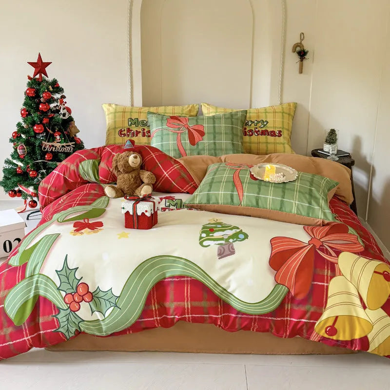 Christmas cartoon print bedding four-piece set on a bed, showing duvet cover and pillowcases.