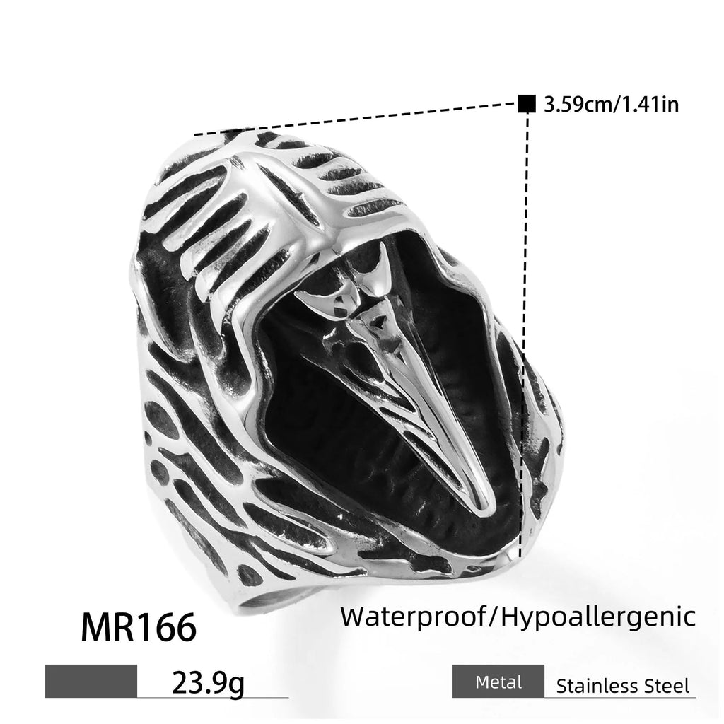 Geometric crow punk ring in titanium steel, MR166 colour, shown on a finger.