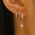 Ladies three-piece zircon inlaid geometric earring set with pendant, stud and clip styles in gold finish