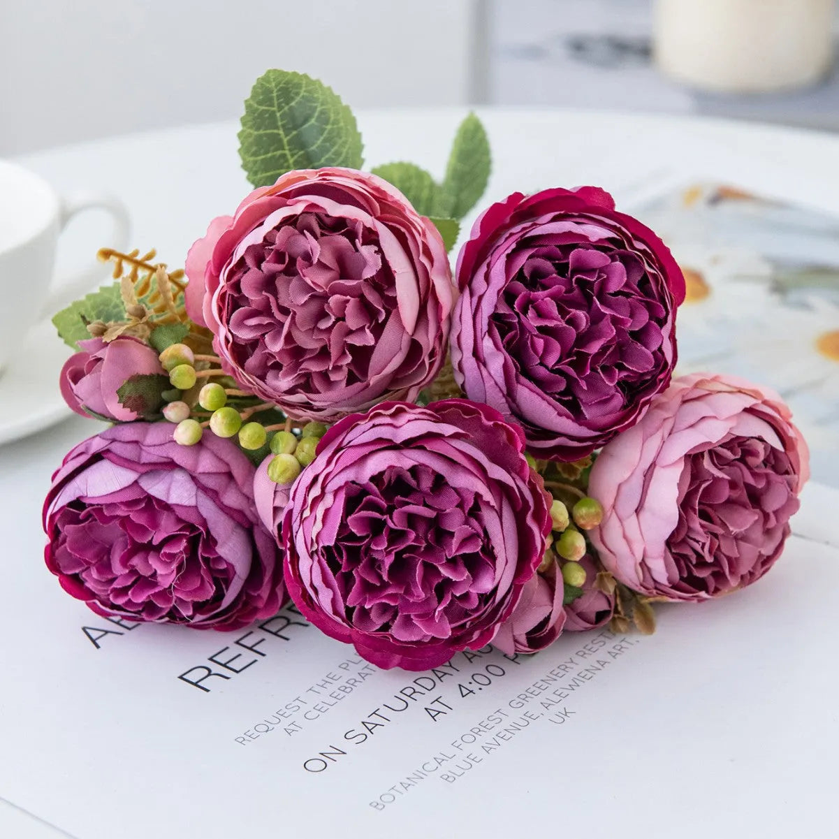 Silk artificial peony bouquet arrangement in champagne colour for home or wedding decor.