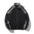Men's black polyester jacket with contrast stitching and side seam pockets on a model