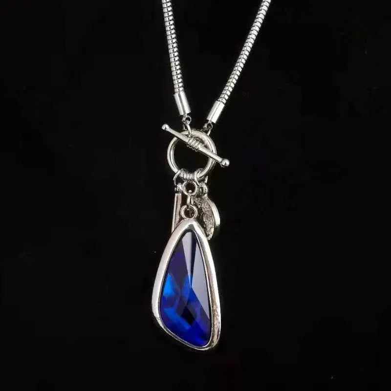 Long geometric plaid alloy pendant on a snake bones chain necklace in blue, champagne, or grey.