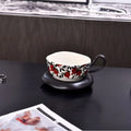 Antique style ceramic coffee cup and saucer with 210ml capacity in black pomegranate or orange citrus pattern.