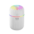 Mini green car-shaped USB aromatherapy humidifier with compact plastic housing on a white background.