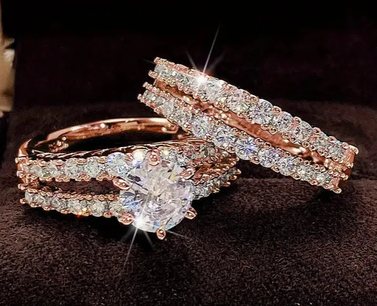 Geometric fully-jewelled female ring set in silver, gold, and rose gold colour options on a size chart.