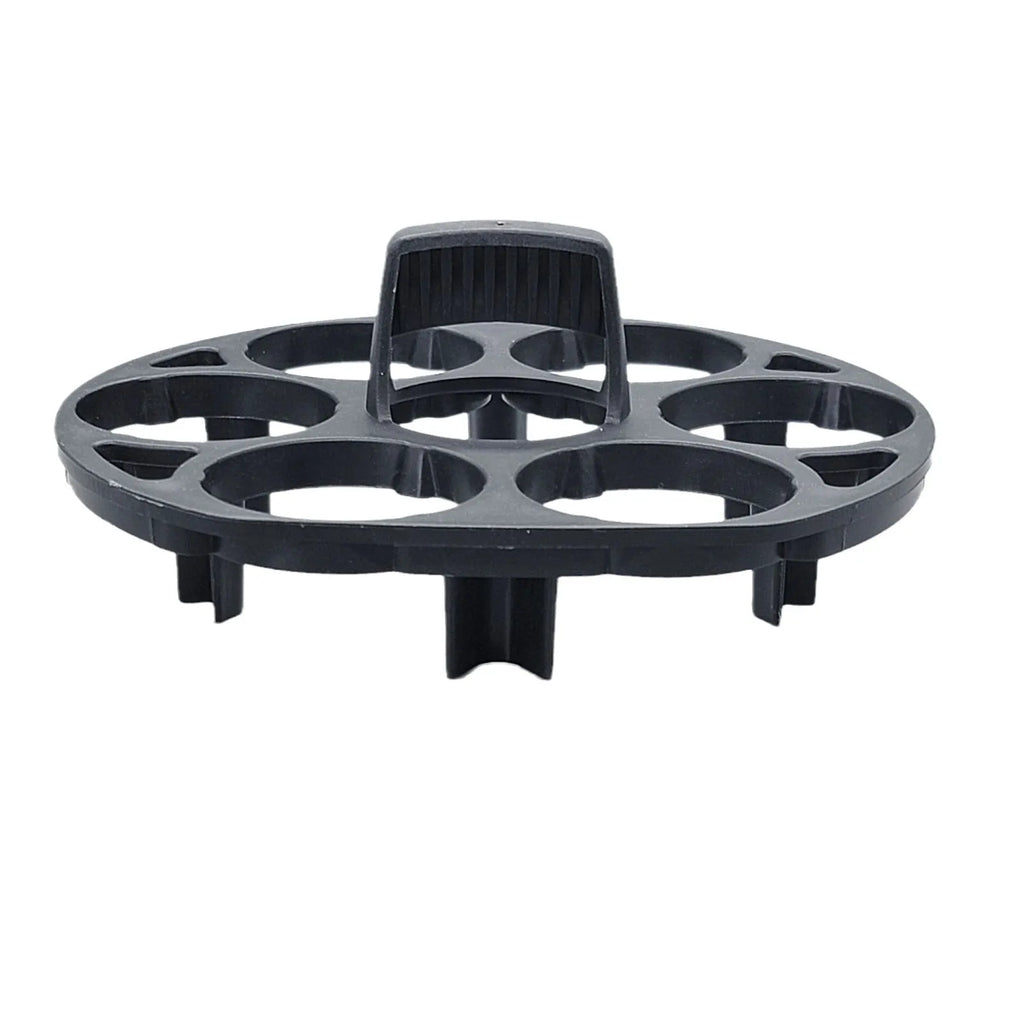 Black plastic egg holder cooking basket rack on a kitchen counter.
