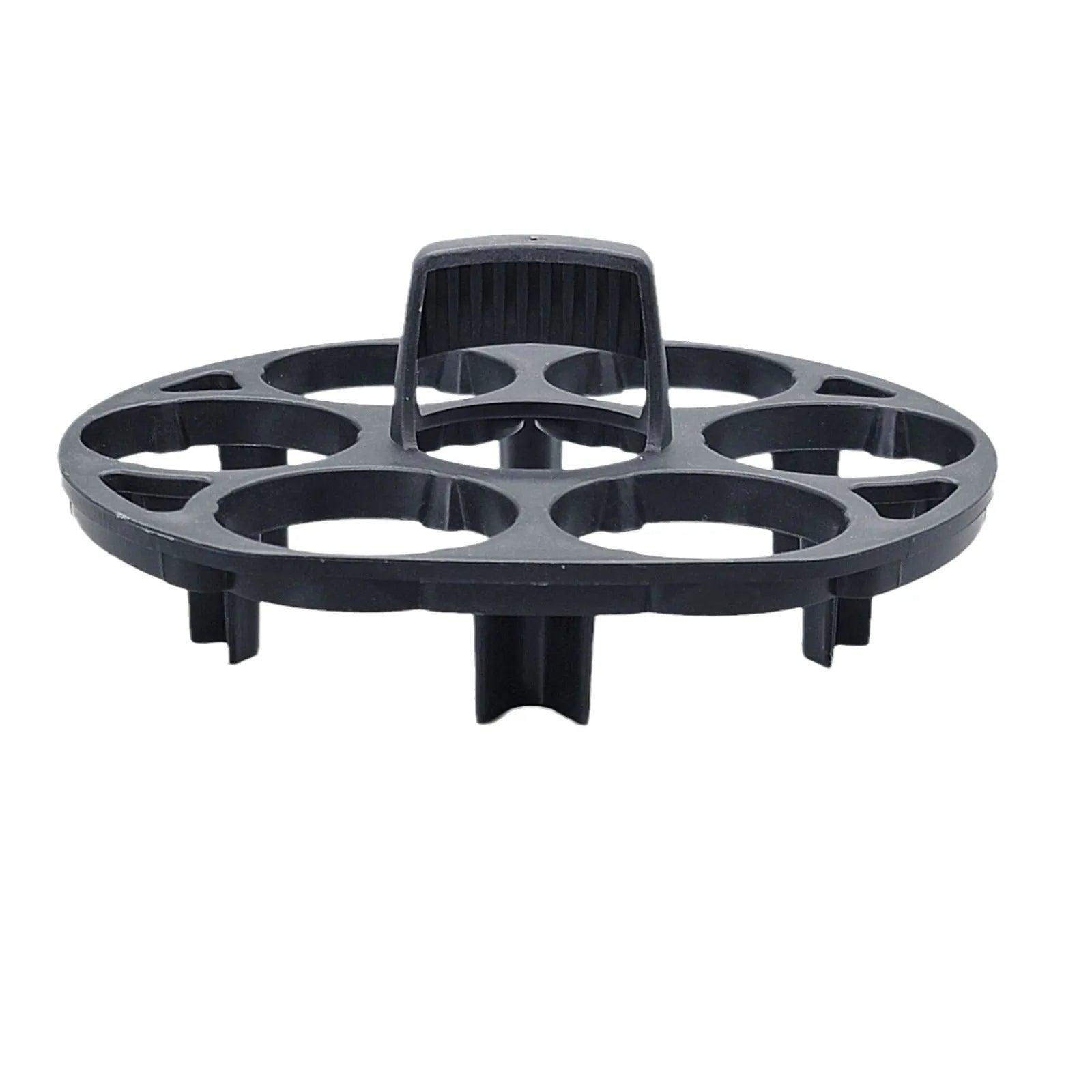 Black plastic egg holder cooking basket rack on a kitchen counter.