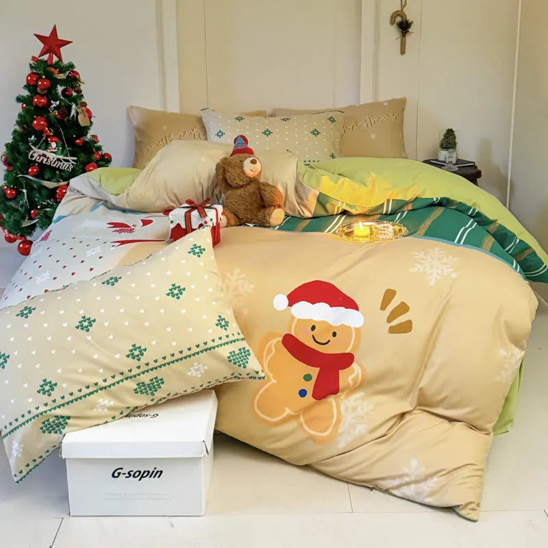Christmas cartoon print bedding four-piece set on a bed, showing duvet cover and pillowcases.