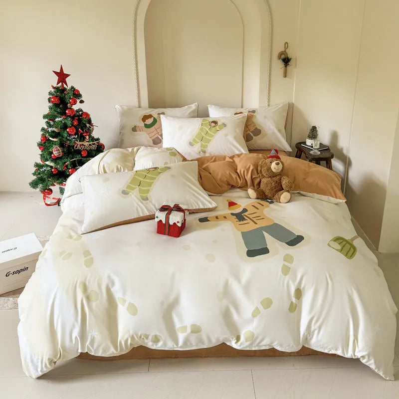 Christmas cartoon print bedding four-piece set on a bed, showing duvet cover and pillowcases.