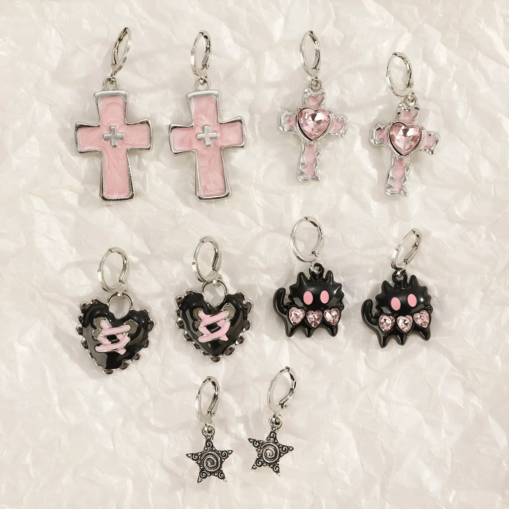 Women's classic alloy earrings showing cross, heart, and animal designs in white, black, and silver colours