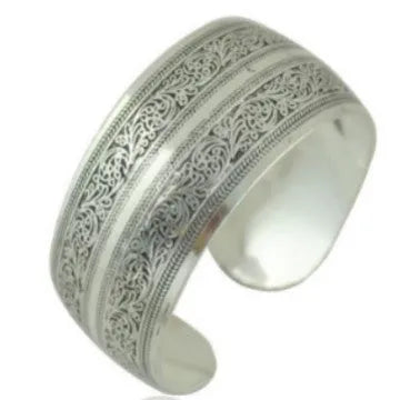 Silver Miao ethnic carved openwork Roman bracelet with elephant motif on alloy material