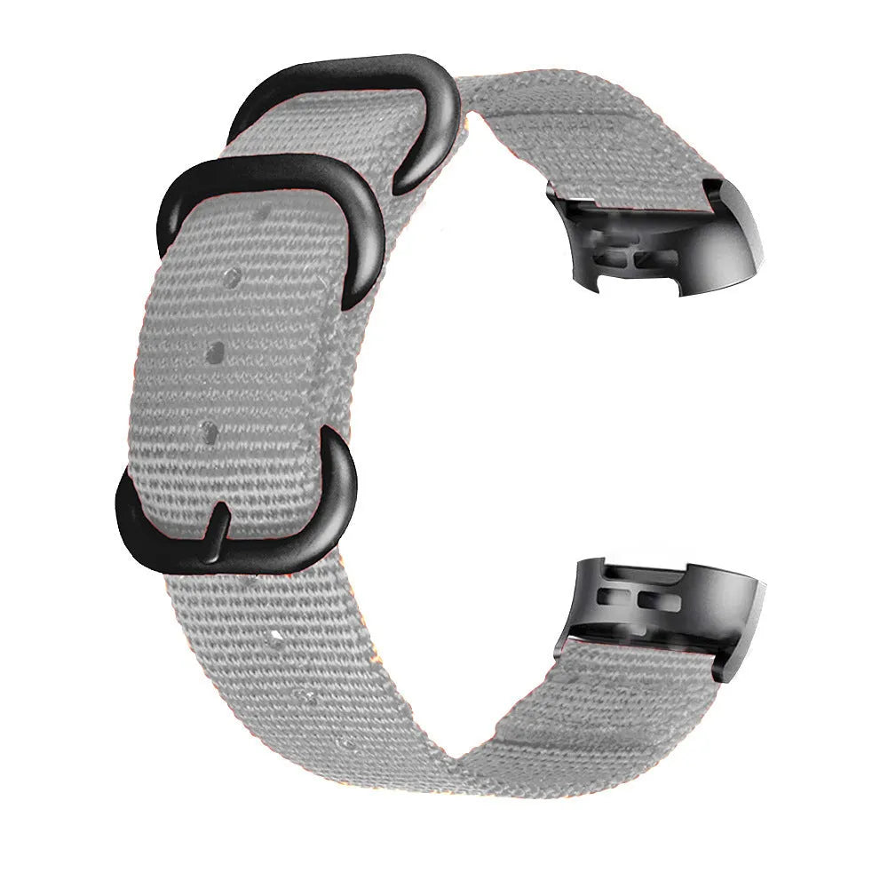 Nylon replacement watch strap with three-ring buckle for Fitbit Charge 2, 3, 4, and 5 fitness trackers.