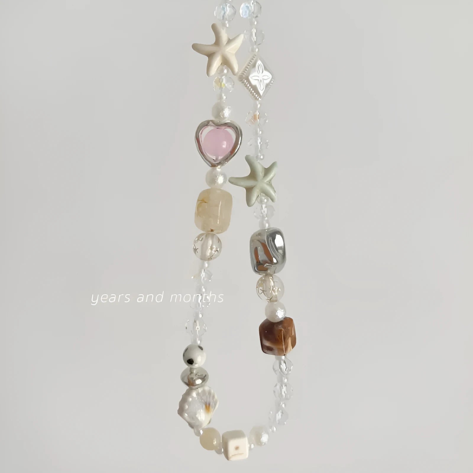 Bohemian sweetheart design alloy mobile phone charm in island sweetheart colour with chain.