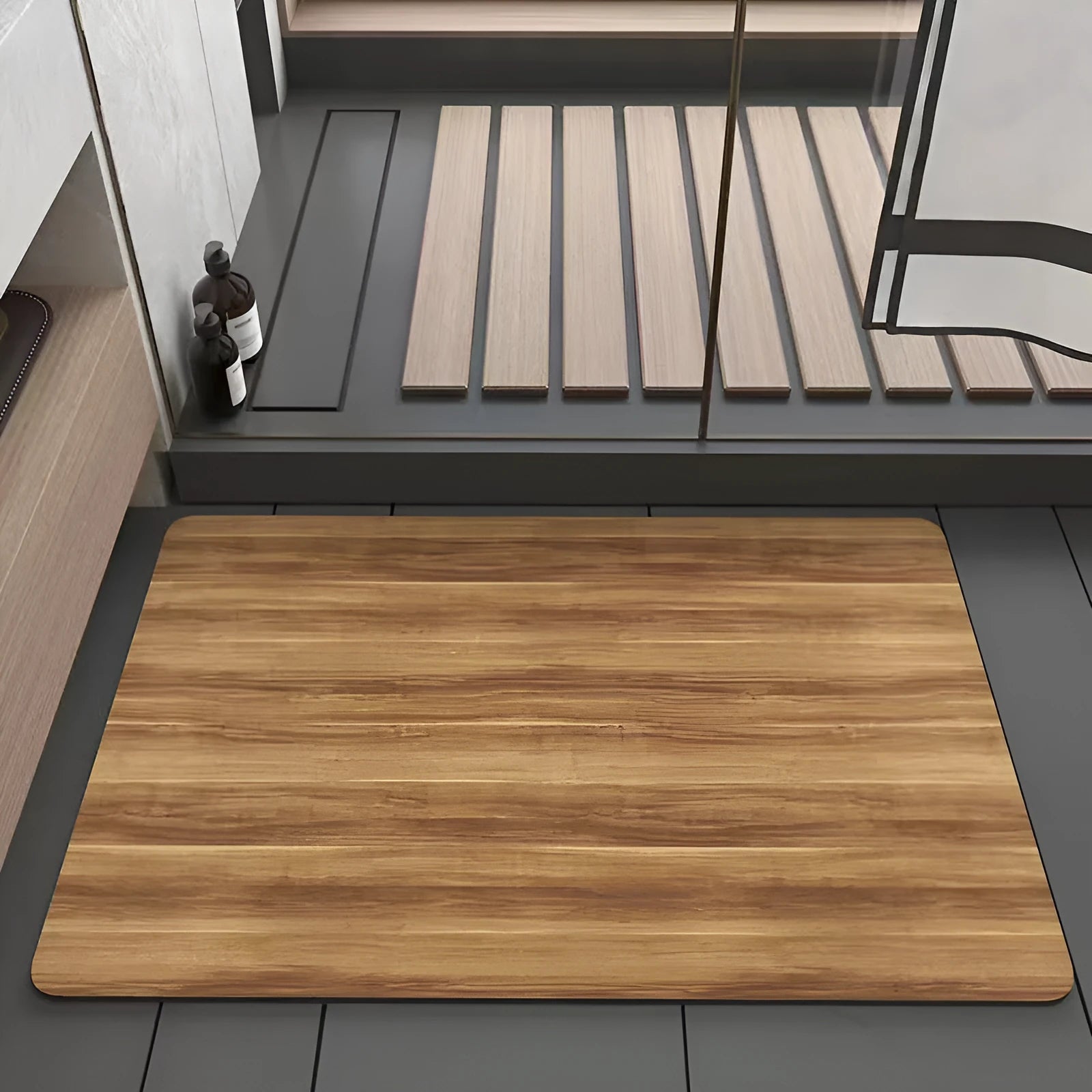 Square diatomite bathroom mat with wood grain pattern on a bathroom floor.