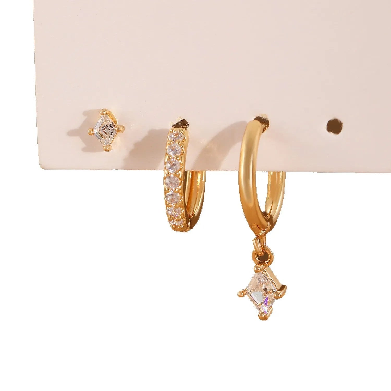 Ladies three-piece zircon inlaid geometric earring set with pendant, stud and clip styles in gold finish