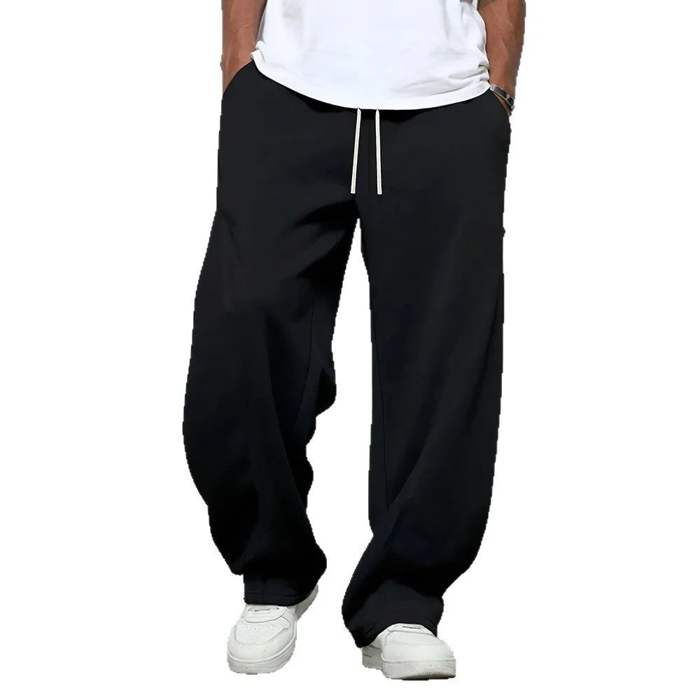 Men's straight leg casual trousers in black, dark grey and light grey colours with a drawstring waist.