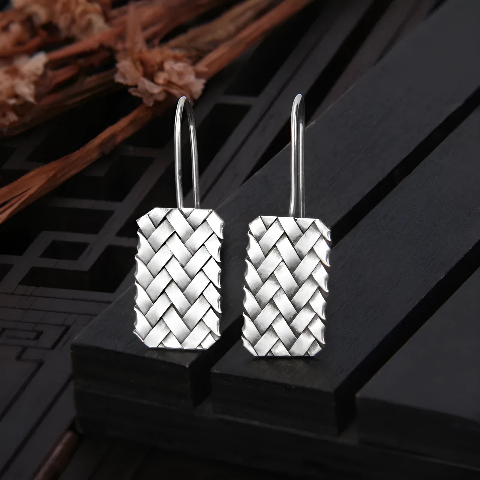 Geometric diamond plaid pattern earrings made from silver-coloured 925 silver.